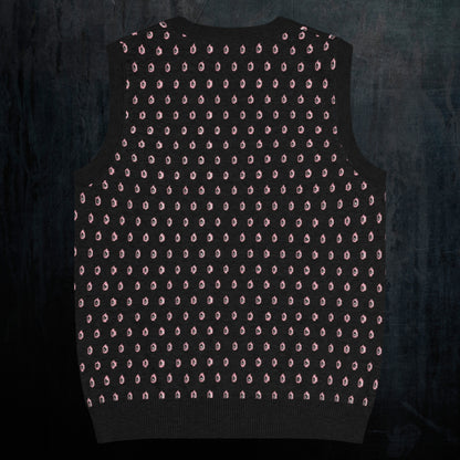 a black knitted vest with crying pink flowers and droplets