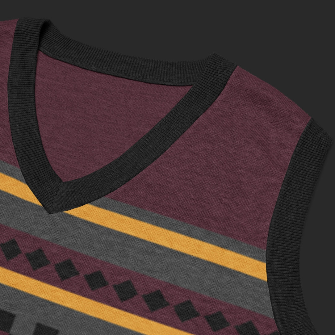 An alt style knitted vest with an irregular unexpected pattern and cool color combination of burgundy and mustard