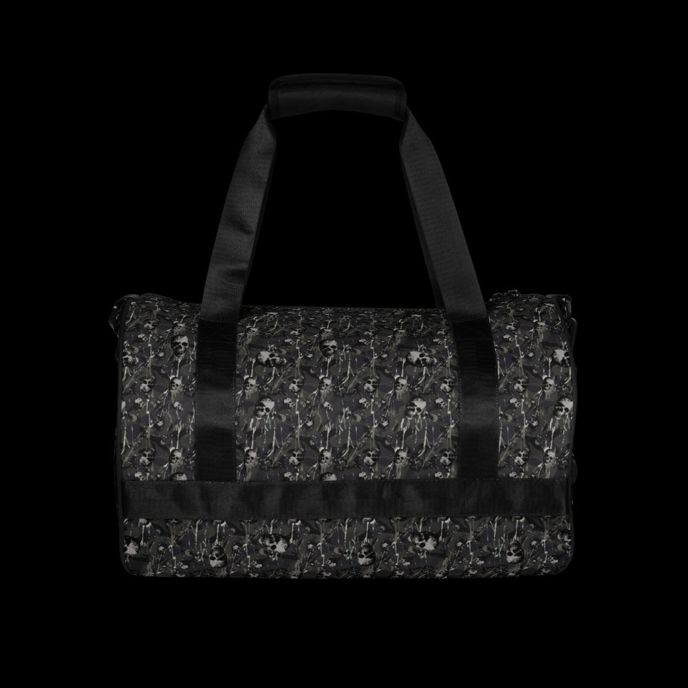 a duffel gym bag with a camo, paint splatter, and gritty skulls pattern in grey camo shades