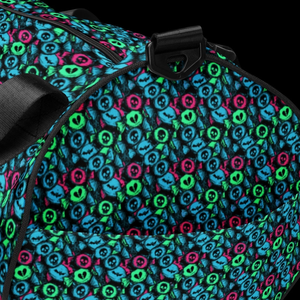 Duffel bag with a skull candy pattern in neon teal green and pink shades