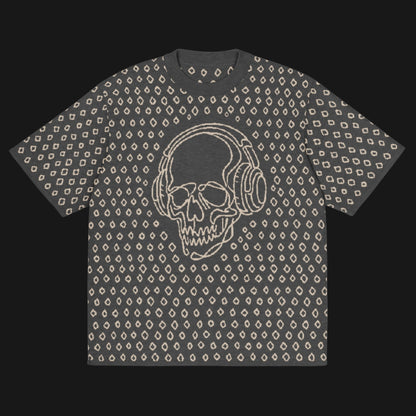 A grey short sleeve knit featuring a line art skull with headphones and hand drawn diamonds