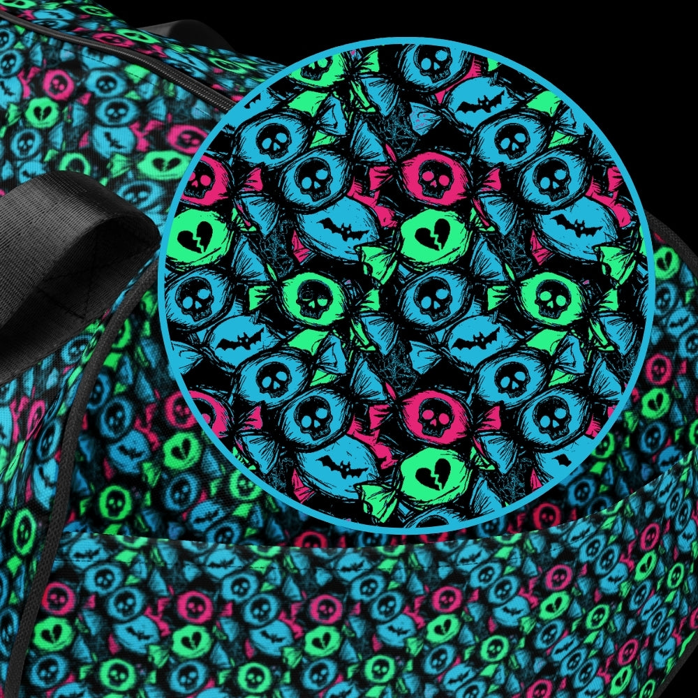 Duffel bag with a skull candy pattern in neon teal green and pink shades