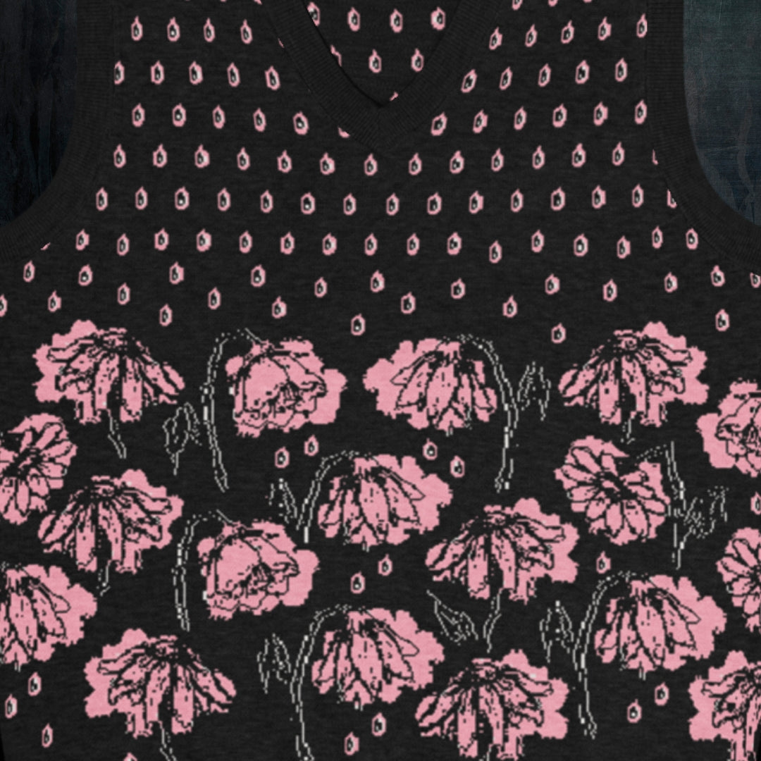 a black knitted vest with crying pink flowers and droplets