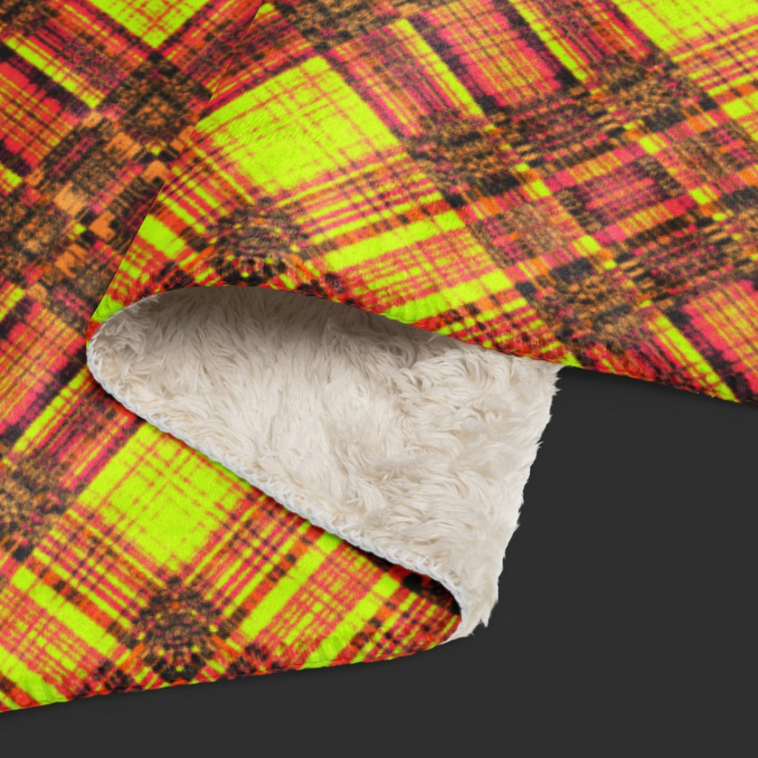 large fleece sherpa blanket with a distressed plaid pattern in yellow and rusty pink