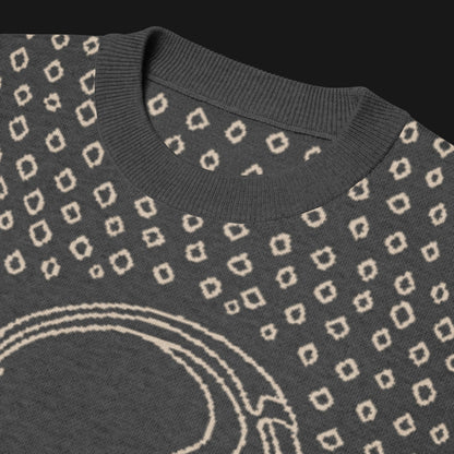 A grey short sleeve knit featuring a line art skull with headphones and hand drawn diamonds