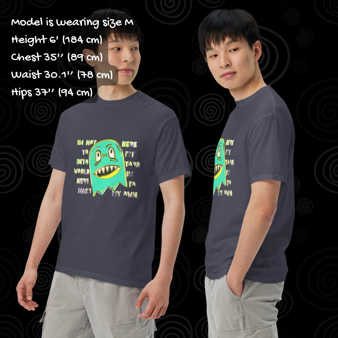 Person wearing a Comfort colors 1717 tee with a monster and text "i'm not her to fit into your world, i'm here to make my own" with sizing info