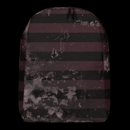 a grunge striped backpack in deep burgundy red and black, with a grungy collage that's visible close-up. 