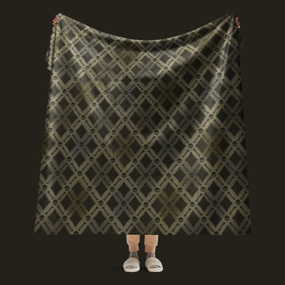 A fleece sherpa blanket with a soft argyle pattern and skulls and bones diagonals