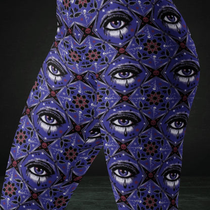 Blue kaleidoscope like leggings with crying eyes and emo symbols