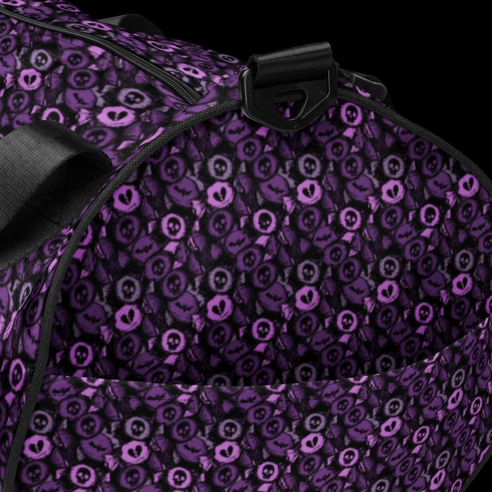 Duffel bag with a skull candy pattern in purple shades