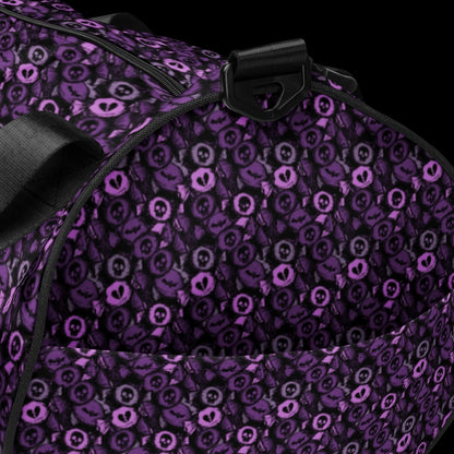 Duffel bag with a skull candy pattern in purple shades
