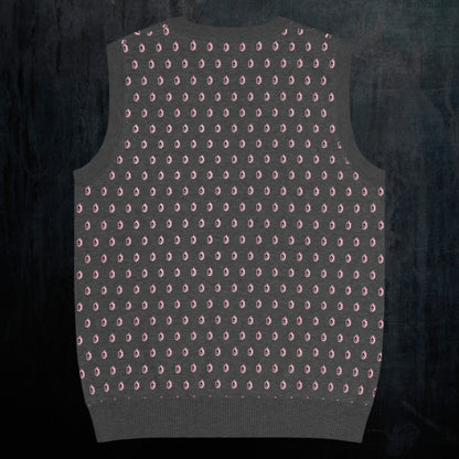 a charcoal knitted vest with crying pink flowers and droplets
