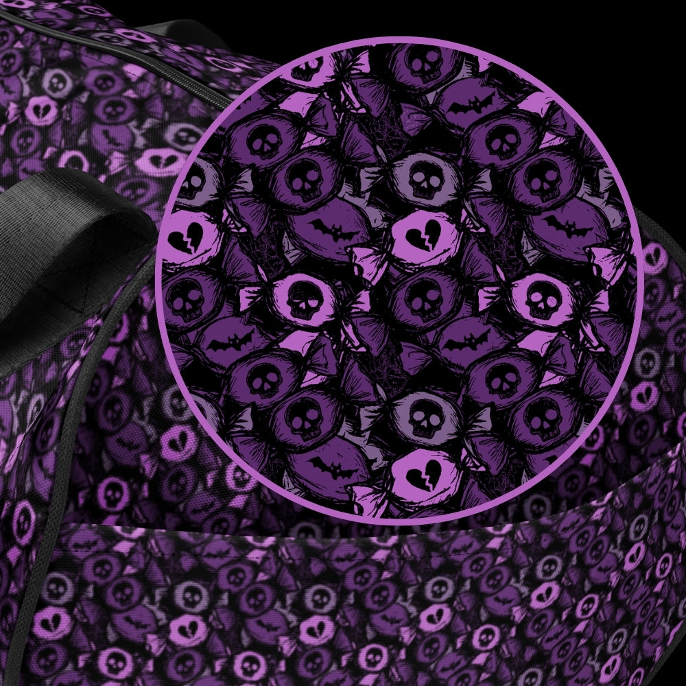 Duffel bag with a skull candy pattern in purple shades