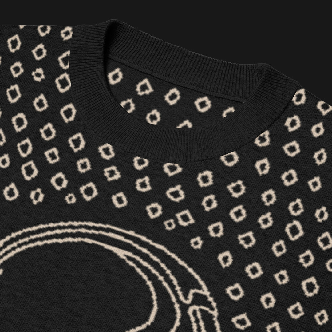 A black short sleeve knit featuring a line art skull with headphones and hand drawn diamonds