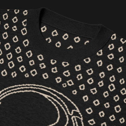 A black short sleeve knit featuring a line art skull with headphones and hand drawn diamonds