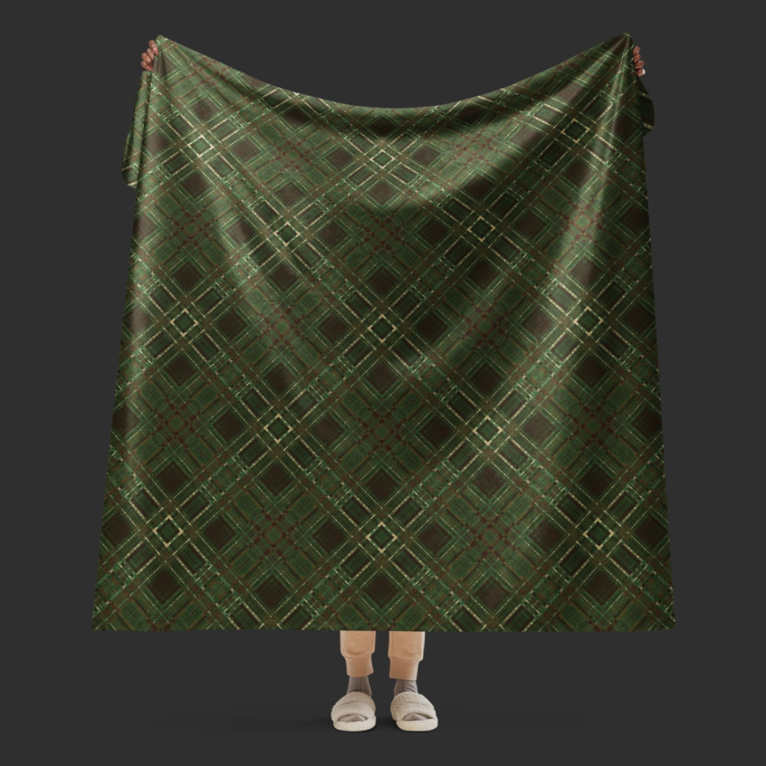 A large fleece sherpa blanket with a distressed plaid pattern in forest witchy shades