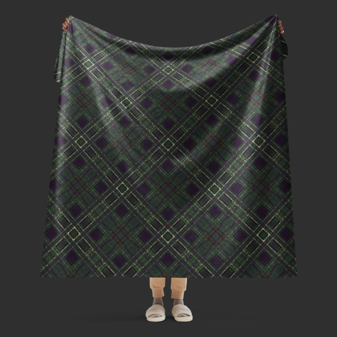 A large fleece sherpa blanket with a distressed plaid pattern in forest witchy shades