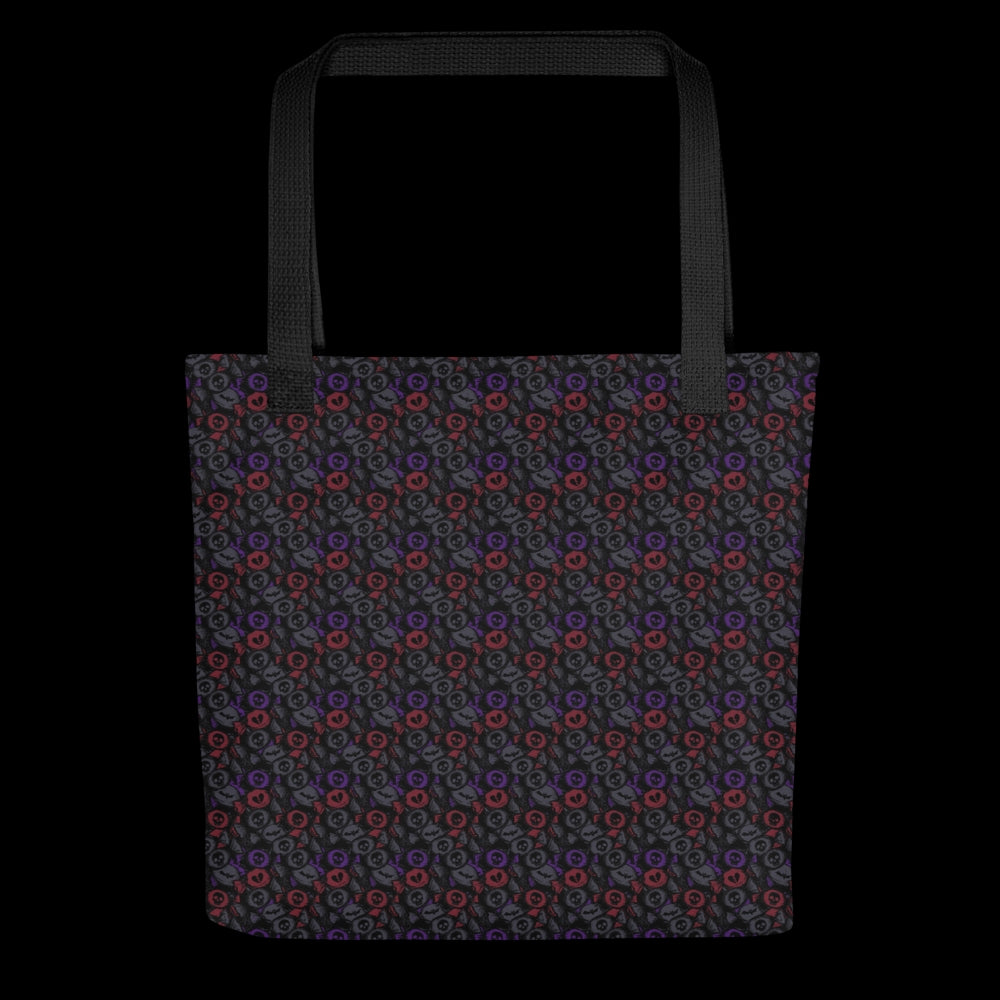A tote bag with a skull candy pattern in dark grey, purple and red