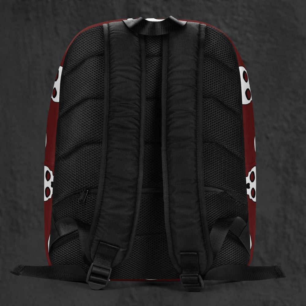 a backpack with a large skull pattern on deep red