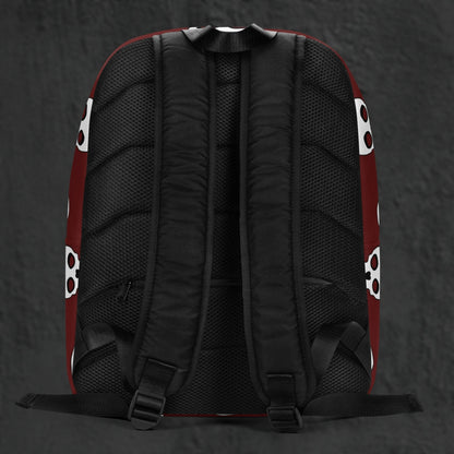 a backpack with a large skull pattern on deep red