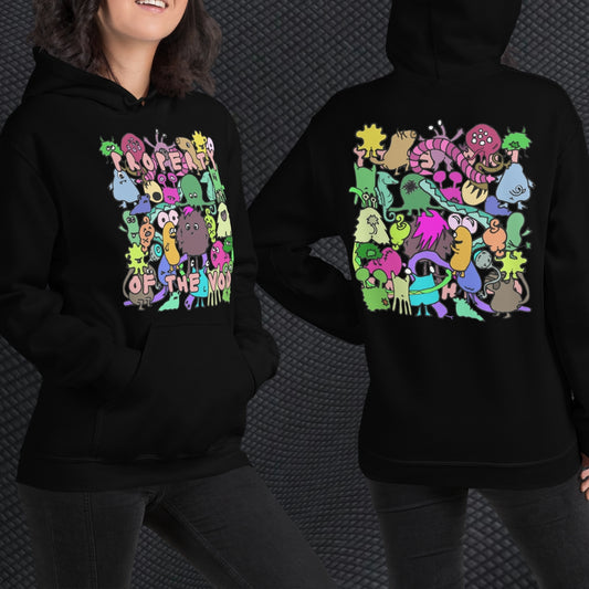 a woman wearing a black hoodie with front print a colorful horde of goblins and text "property of the void" and on the back, the goblins seen from the back