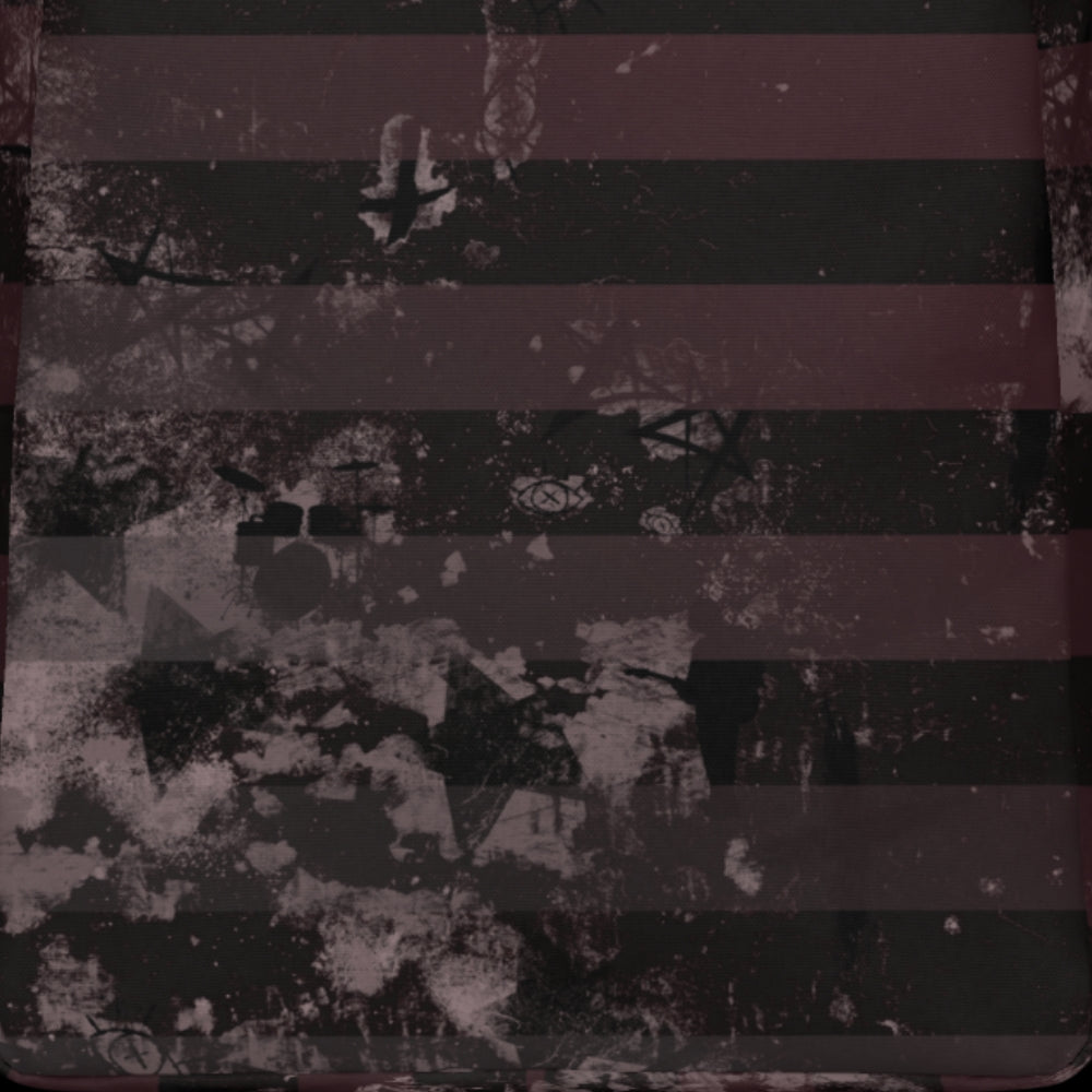 a grunge striped backpack in deep burgundy red and black, with a grungy collage that's visible close-up. 