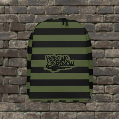 Backpack with green and black grunge style dark stripes and text "here we are now" in graffiti tag style