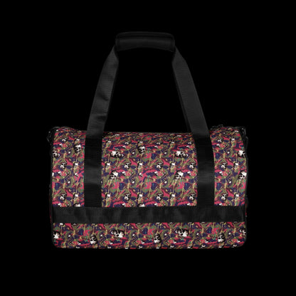 a duffel gym bag with a camo, paint splatter, and gritty skulls pattern in pink and purple shades
