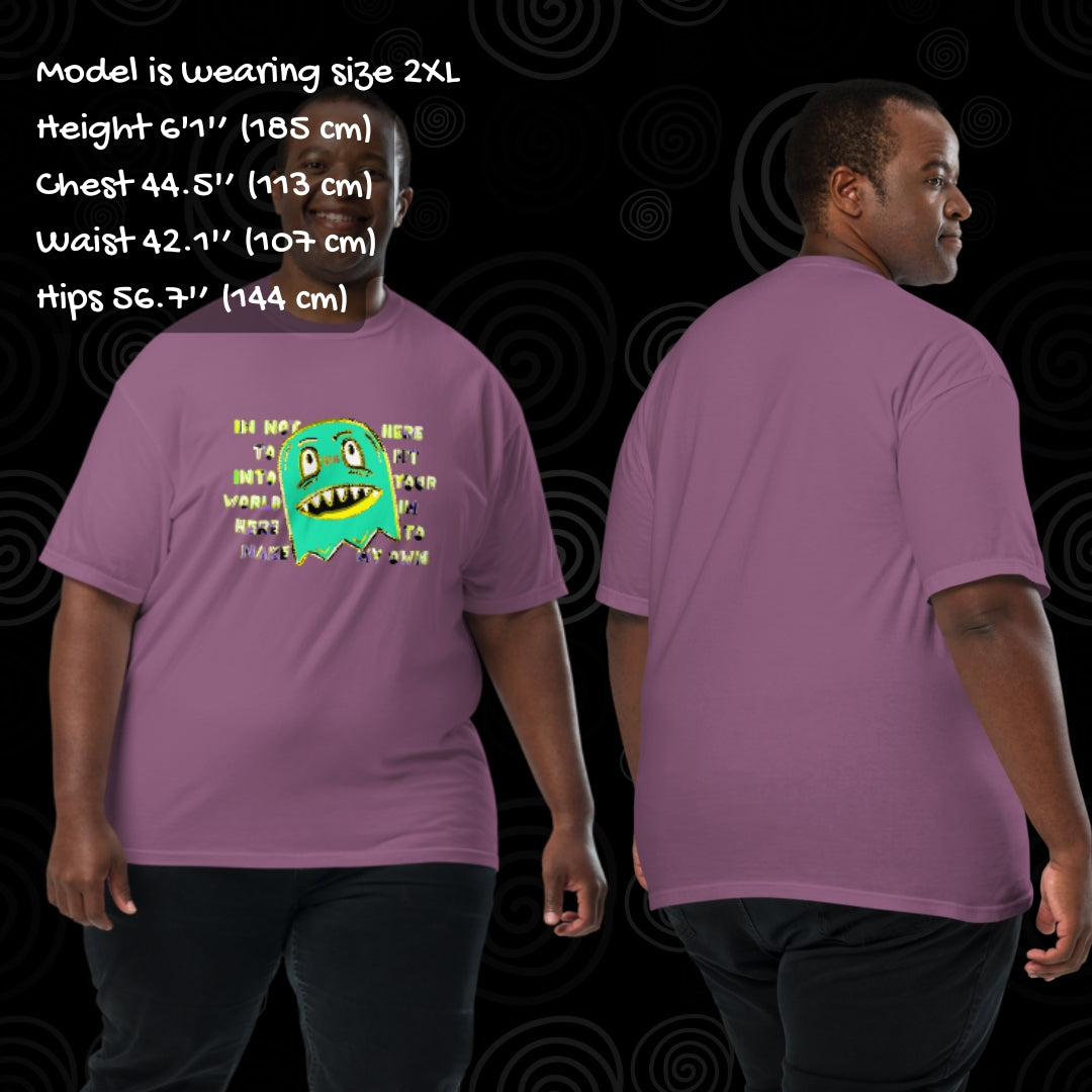 Person wearing a Comfort colors 1717 tee with a monster and text "i'm not her to fit into your world, i'm here to make my own" with sizing info