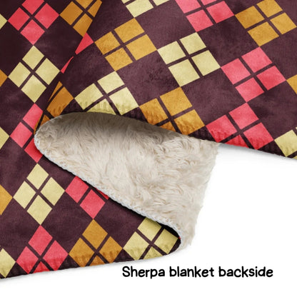 Patterned blanket with Sherpa lining on a white background