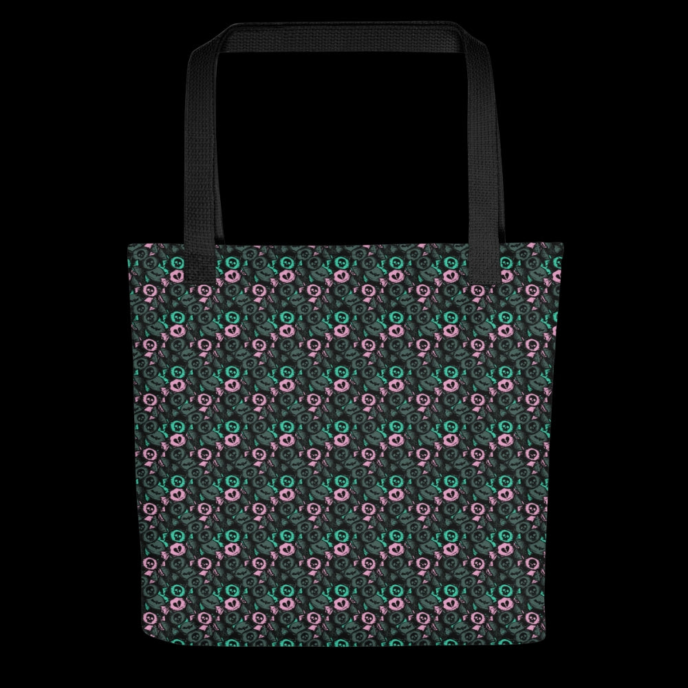 A tote bag with a skull candy pattern in grey teal and pink
