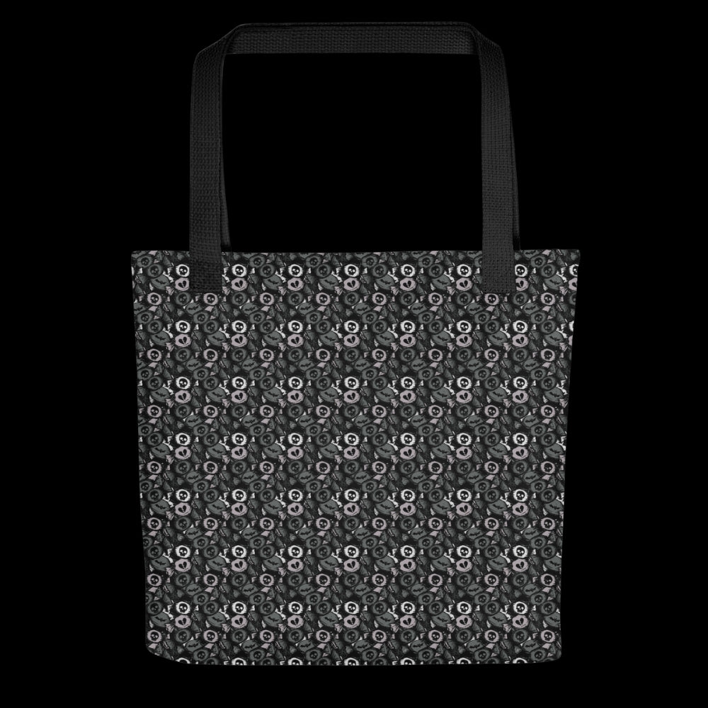 A tote bag with a skull candy pattern in grey shades