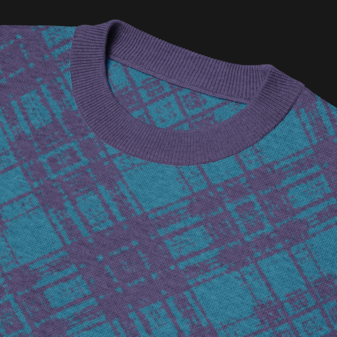 A bright blue glitched plaid pattern knitted tee
