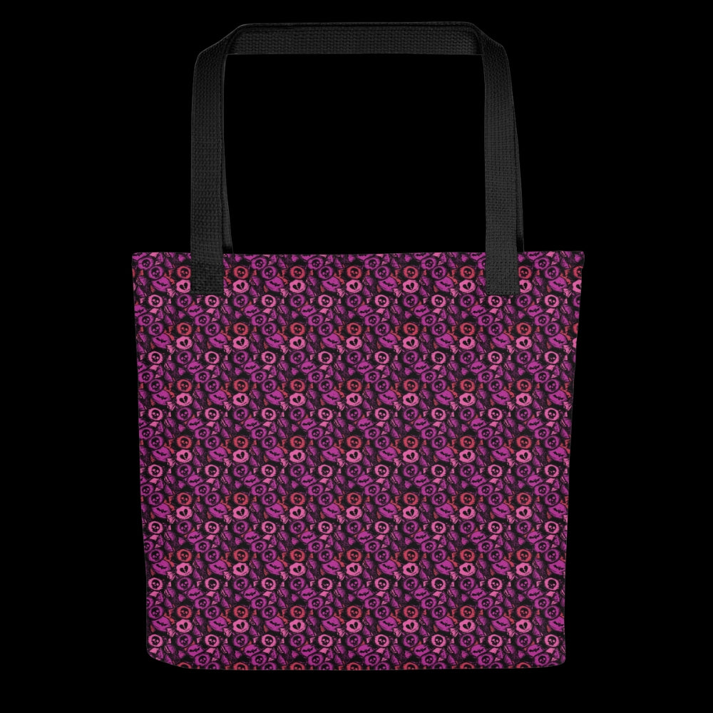 A tote bag with a skull candy pattern in pink red and purple