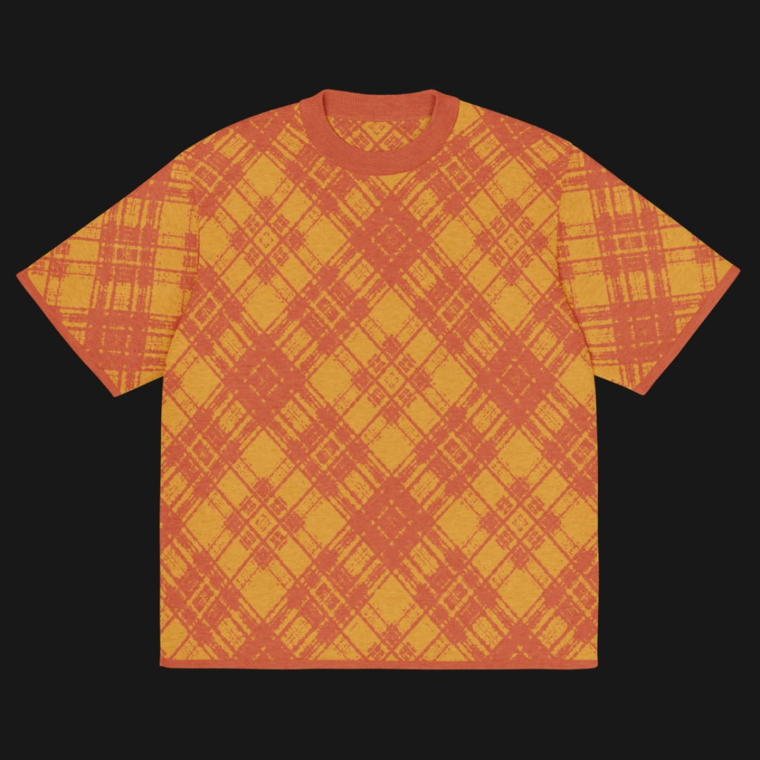 A bright orange glitched plaid pattern knitted tee