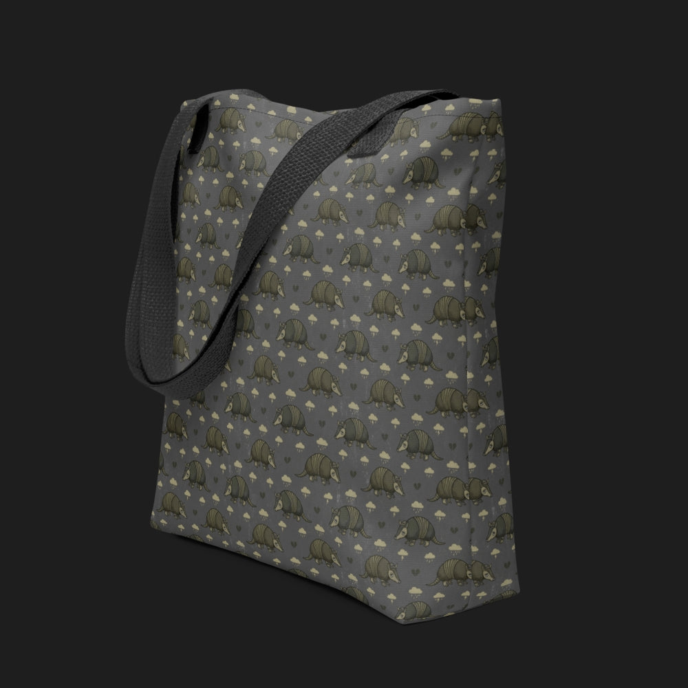 tote bag with an emo armadillo pattern with broken hearts and storm clouds in brownish grey