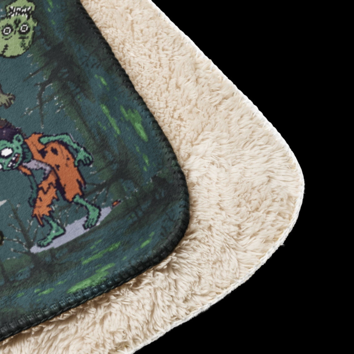 A large sherpa lined blanket featuring a zombie invasion and a maze for finding brains for the zombies