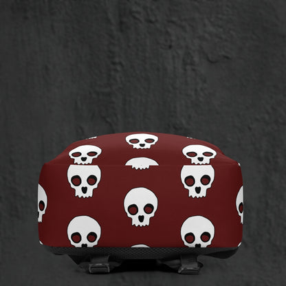 a backpack with a large skull pattern on deep red