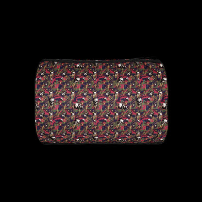 a duffel gym bag with a camo, paint splatter, and gritty skulls pattern in pink and purple shades