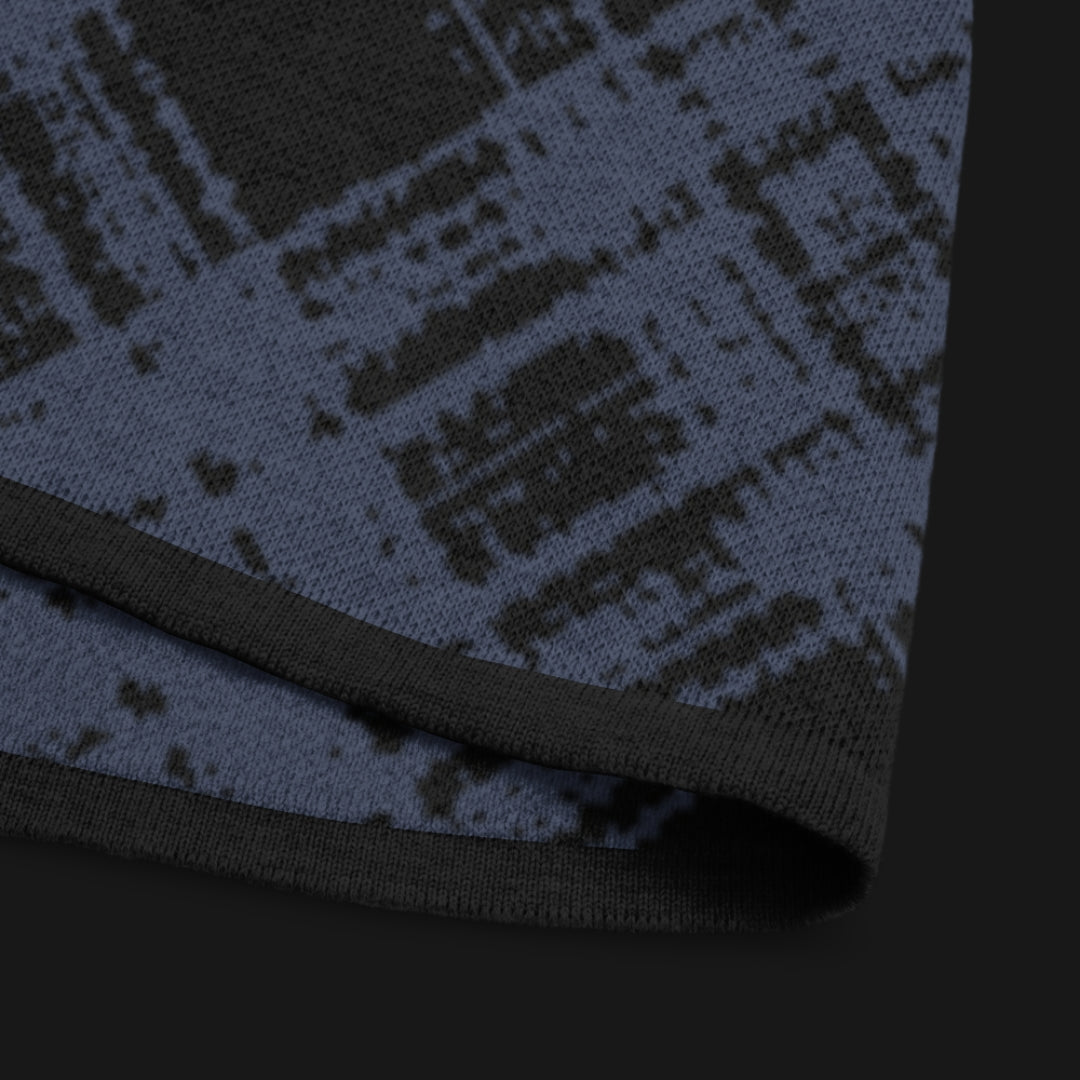 A dark black and blue broken plaid pattern knitted teev