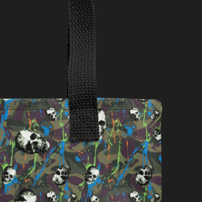 Tote bag with a rebellious camo background, gritty skulls, and neon splatter