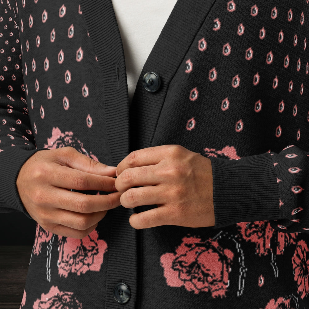 Person wearing an emotional black knitted cardigan with tears and crying flowers