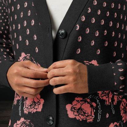 Person wearing an emotional black knitted cardigan with tears and crying flowers