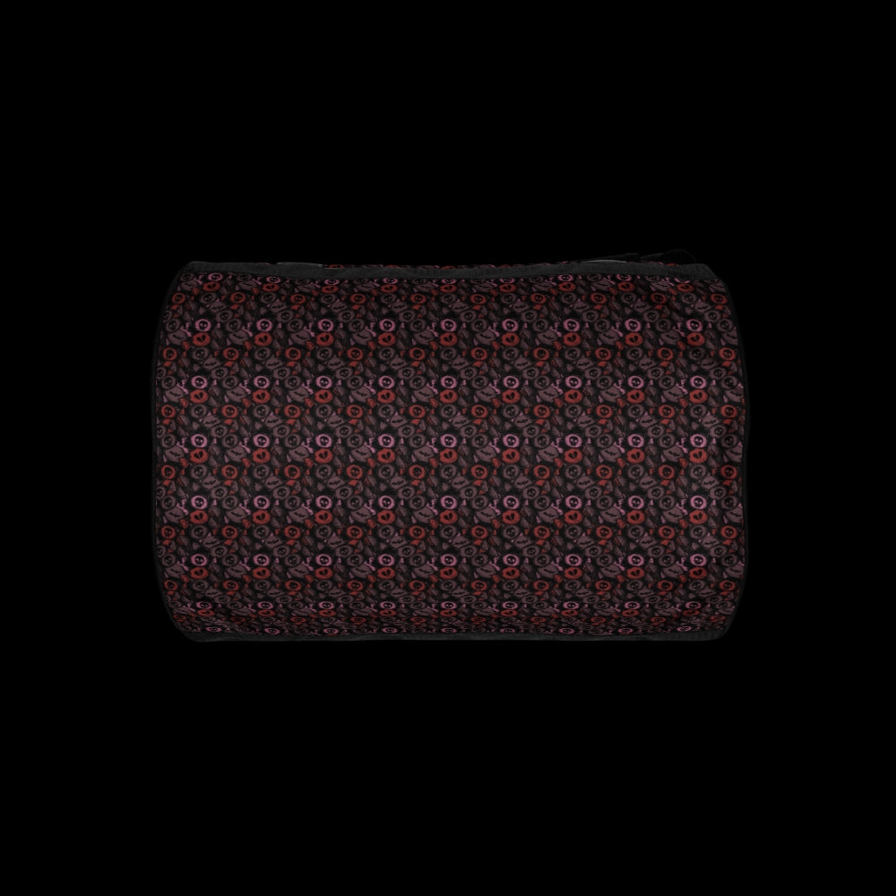 Duffel bag with a skull candy pattern in red crushed velvet shades