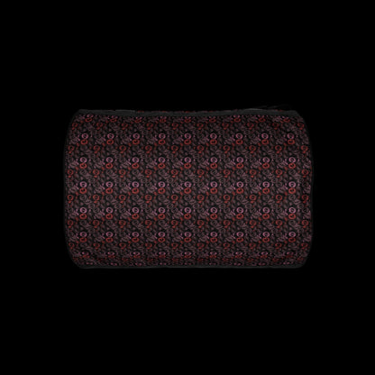 Duffel bag with a skull candy pattern in red crushed velvet shades