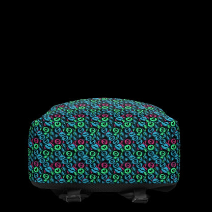 a backpack with an alt emo skull candy pattern in teal pink and green