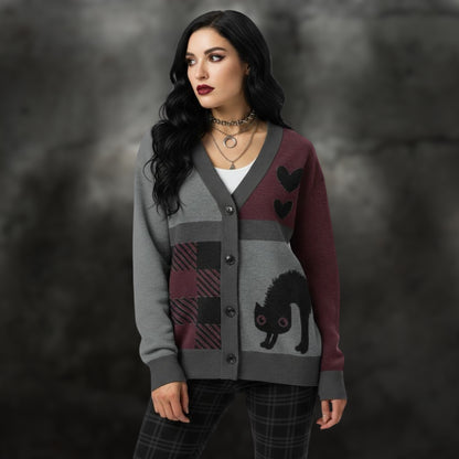 Alt style woman wearing a burgundy, grey and black knitted cardigan with patchwork pattern areas