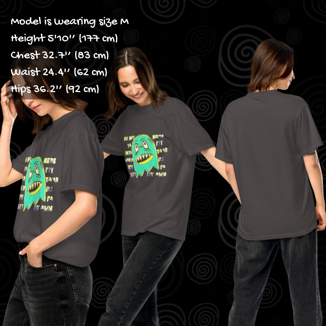 Person wearing a Comfort colors 1717 tee with a monster and text "i'm not her to fit into your world, i'm here to make my own" with sizing info