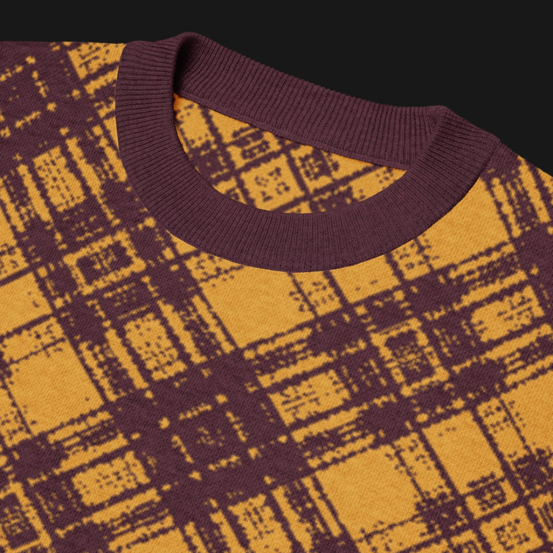 A burgundy and mustard glitched plaid pattern knitted tee