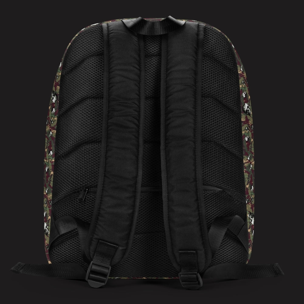 a backpack with a camo and paint and gritty skulls pattern in burgundy and green